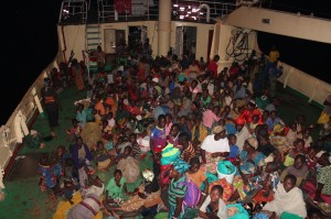 Burundian refugee on a boat heading to Tanzania for safety. 