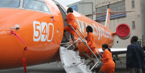 Fly540 staff board a plane at Wilson Airport in Nairobi. JamboJet, a subsidiary of Kenya Airways, and Fly540 are the two main airlines that serve the local towns in Kenya. PHOTO | FILE |  NATION MEDIA GROUP