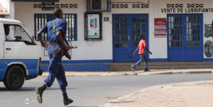  A lone police officer runs in the direction of the old market in the Burundian capital, Bujumbura August 2, 2015. The UN has reported an increase in arrests, detention and killings in Burundi since the beginning of September. PHOTO | FILE |  AFP By HAVYARIMANA MOSES