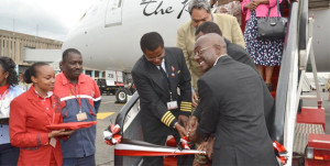 KQ CEO (then COO) Mbuvi Ngunze (right) welcomes a Dreamliner jet last June. PHOTO | FILE   By REUTERS