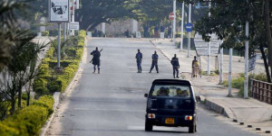 Police officers stand at a check point in Bujumbura, Burundi May 14, 2015. The head of Burundi's armed forces on September 11 survived an assassination attempt in the capital Bujumbura, police said, adding that at least seven other people were killed in the attack. PHOTO | REUTERS  