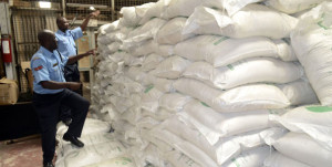 Police officers inspect sugar confiscated in Mombasa. Sugar industry regulators and tax agencies in EAC have been involved in frequent standoffs over dumping of duty-free sugar within eastern Africa. PHOTO | FILE 